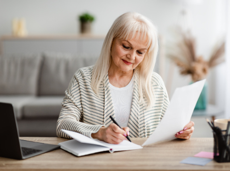 Couple looking at calculator and making list