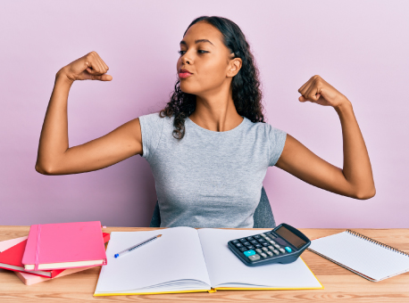 woman flexing muscles while working