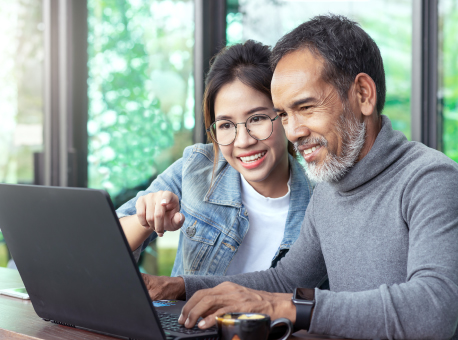 father and daughter on computer