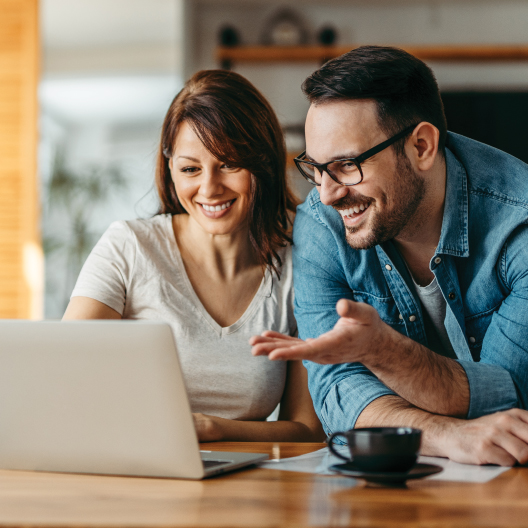 Couple browsing website on laptop