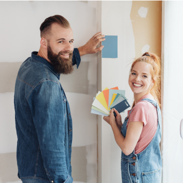 Couple painting walls